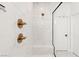 Close up of shower featuring marble tile and a frameless glass surround at 3243 Fountaintree Ave, Henderson, NV 89044