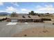 Inviting single-story home with manicured front yard and an attached garage at 3450 Oakleaf Ave, Pahrump, NV 89048