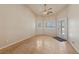 Bright living space with tile flooring, ceiling fan, and windows with plantation shutters at 3450 Oakleaf Ave, Pahrump, NV 89048