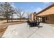 Relax on the covered patio with backyard and black outdoor furniture, perfect for entertaining guests at 3450 Oakleaf Ave, Pahrump, NV 89048