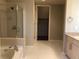 Spacious bathroom featuring a glass shower, soaking tub, and modern vanity at 353 E Bonneville Ave # 621, Las Vegas, NV 89101