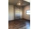 Modern bedroom with wood floors, a large window, and industrial-style decor at 353 E Bonneville Ave # 621, Las Vegas, NV 89101