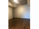 Clean and bright bedroom with wood flooring and industrial-style ceiling fixtures at 353 E Bonneville Ave # 621, Las Vegas, NV 89101