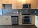 Updated kitchen featuring stainless steel appliances, modern cabinetry, and sleek countertops at 353 E Bonneville Ave # 621, Las Vegas, NV 89101