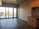 Bright living room featuring wood floors, sliding glass doors and a balcony with city views at 353 E Bonneville Ave # 621, Las Vegas, NV 89101