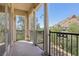 Inviting balcony showcasing desert landscape views, stone columns, and wrought iron railing at 36 Via Vasari # 201, Henderson, NV 89011