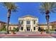 Attractive commercial building featuring classic architectural details and symmetrical design, set under a clear, blue sky at 36 Via Vasari # 201, Henderson, NV 89011