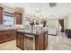 Open kitchen featuring a large island, wine cooler and seamless flow into the living area at 36 Via Vasari # 201, Henderson, NV 89011