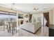 Elegant living room featuring a fireplace, tile flooring, and a view to the outside at 36 Via Vasari # 201, Henderson, NV 89011