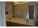 Bathroom featuring double sinks, vanity, and a large mirror at 3745 Saint Peter Ct, North Las Vegas, NV 89031