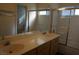 Bathroom showcasing double sinks, a shower-tub combo, and tiled walls at 3745 Saint Peter Ct, North Las Vegas, NV 89031