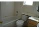 Bathroom with tile surround shower and bath with sink and commode at 3745 Saint Peter Ct, North Las Vegas, NV 89031