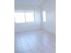 Bright bedroom featuring tile flooring, ample natural light, and neutral paint at 3745 Saint Peter Ct, North Las Vegas, NV 89031