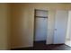 Bedroom showcasing the closet with sliding doors and wood-look flooring at 3745 Saint Peter Ct, North Las Vegas, NV 89031