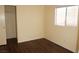 Bright bedroom with neutral walls, wood-look flooring, window and closet at 3745 Saint Peter Ct, North Las Vegas, NV 89031