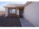 Inviting front entrance with a security screen door, gravel landscaping, and covered porch at 3745 Saint Peter Ct, North Las Vegas, NV 89031