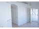 Bright hallway featuring tile flooring and an open doorway to the exterior at 3745 Saint Peter Ct, North Las Vegas, NV 89031
