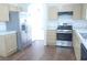 Kitchen featuring stainless steel appliances, ample cabinets, and tile countertops at 3745 Saint Peter Ct, North Las Vegas, NV 89031