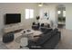 Staged living room showcasing neutral tones, area rug, modern furniture, and natural light at 3745 Saint Peter Ct, North Las Vegas, NV 89031