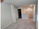 Carpeted hallway on the upper level with natural light and neutral paint color at 3816 Seyfert Ave, North Las Vegas, NV 89084