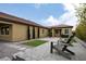 Relax in this private backyard featuring pavers, artificial turf, and mature landscaping at 3870 Valles Caldera Ct, Las Vegas, NV 89118