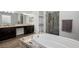 Bright bathroom with dual sinks, standalone tub, and walk-in shower at 3870 Valles Caldera Ct, Las Vegas, NV 89118
