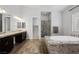 Bathroom featuring dual sinks, separate shower and tub with designer tile at 3870 Valles Caldera Ct, Las Vegas, NV 89118