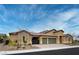 Single-story home with three-car garage and minimalist desert landscaping at 3870 Valles Caldera Ct, Las Vegas, NV 89118