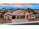Beautiful single-story home boasts three-car garage and desert landscaping at 3870 Valles Caldera Ct, Las Vegas, NV 89118