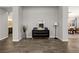 A view of a hallway with neutral colors, modern furniture, and access to different rooms in the home at 3870 Valles Caldera Ct, Las Vegas, NV 89118
