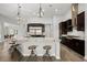 Well-equipped kitchen boasts granite countertops, stainless steel appliances, a center island, and bar seating at 3870 Valles Caldera Ct, Las Vegas, NV 89118