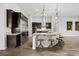 Well-equipped kitchen features stainless steel appliances, granite countertops, a center island, and bar seating at 3870 Valles Caldera Ct, Las Vegas, NV 89118
