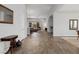 Spacious living room showcases wood-look flooring, neutral walls, and an open layout with ample natural light at 3870 Valles Caldera Ct, Las Vegas, NV 89118