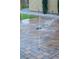 Enjoy the tranquil water feature in this beautifully landscaped backyard with pavers and lush greenery at 3870 Valles Caldera Ct, Las Vegas, NV 89118