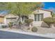 Beautiful one-story home boasting desert landscaping, an attached garage and mature landscaping at 4408 Oasis Hill Ave, North Las Vegas, NV 89085