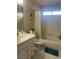 Bathroom featuring a bath tub and a shower combination, a toilet and a single sink vanity at 4454 W Desert Inn Rd # B, Las Vegas, NV 89102