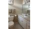Bathroom with a single sink vanity, toilet and a mirrored wall cabinet at 4454 W Desert Inn Rd # B, Las Vegas, NV 89102
