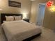 Cozy bedroom featuring queen size bed, night stand and wall decor at 4454 W Desert Inn Rd # B, Las Vegas, NV 89102