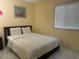 This cozy bedroom features a comfortable bed, neutral decor, and ample natural light at 4454 W Desert Inn Rd # B, Las Vegas, NV 89102