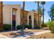 View of a condo building exterior featuring manicured landscape and stone pathway at 4454 W Desert Inn Rd # B, Las Vegas, NV 89102