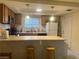Classic kitchen with oak cabinets and white appliances at 4454 W Desert Inn Rd # B, Las Vegas, NV 89102