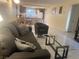 Inviting living room featuring tile floors, neutral walls and natural light at 4454 W Desert Inn Rd # B, Las Vegas, NV 89102