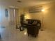 Bright living room with tile flooring, neutral walls, and contemporary furniture at 4454 W Desert Inn Rd # B, Las Vegas, NV 89102
