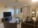 Inviting living room featuring tile floors, neutral walls and natural light at 4454 W Desert Inn Rd # B, Las Vegas, NV 89102