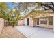 Relaxing backyard featuring an extended patio area, desert landscaping, and private block fencing at 4546 Regalo Bello St, Las Vegas, NV 89135