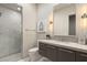 Elegant bathroom featuring marble shower, contemporary vanity, and stylish lighting at 515 Serenity Point Dr, Henderson, NV 89012