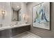 Chic powder room featuring unique glass sink, elegant lighting, and striking artwork at 515 Serenity Point Dr, Henderson, NV 89012