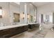 Spacious bathroom featuring dual vanities with stylish mirrors and a freestanding soaking tub at 515 Serenity Point Dr, Henderson, NV 89012