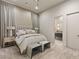 Luxurious bedroom with plush bedding, side tables, and ensuite bath entrance at 515 Serenity Point Dr, Henderson, NV 89012