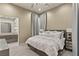 Serene bedroom with plush bedding, ensuite bathroom, and neutral color palette at 515 Serenity Point Dr, Henderson, NV 89012